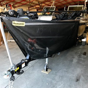 Durable rock guard installed on a boat's hull, providing reliable protection against rocks and debris.